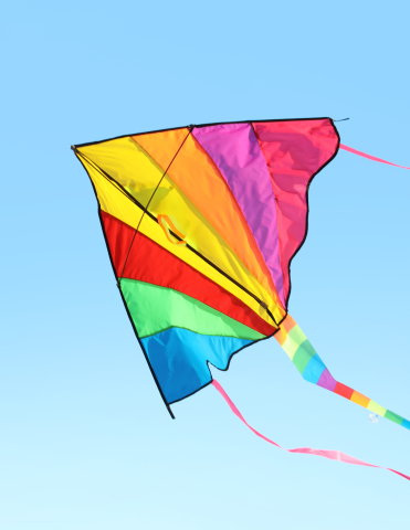 Image of a colorful kite flying in the sky.